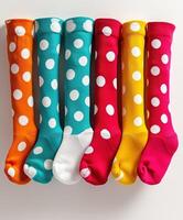 Vibrant Polka Dot Socks in Assorted Colors Neatly Arranged photo