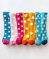 Vibrant Polka Dotted Socks in Assorted Colors Displayed in a Stylish Studio Shot photo