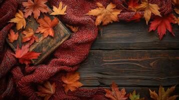 Cozy Autumn Scene with Maple Leaves on Rustic Wooden Background photo