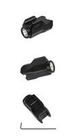 Modern LED flashlight with weapon mount. Underbarrel tactical flashlight isolate on white back. photo
