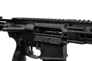 Close-up of the open bolt cover. A modern automatic carbine without sights and with an additional handle. Isolate on a white back photo