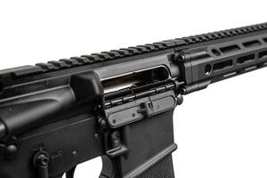 Close-up of the open bolt cover. A modern automatic carbine without sights and with an additional handle. Isolate on a white back photo