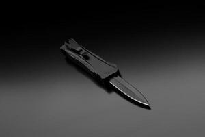 Penknife on a black gradient background. Modern folding knife. photo