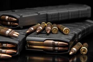 Bullet isolated on black background with reflexion. Rifle bullets close-up on black back. Cartridges for rifle and carbine on a black. photo