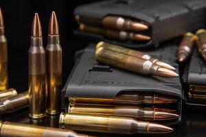 Bullet isolated on black background with reflexion. Rifle bullets close-up on black back. Cartridges for rifle and carbine on a black. photo