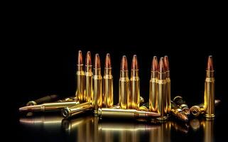 Bullet isolated on black background with reflexion. Rifle bullets close-up on black back. Cartridges for rifle and carbine on a black. photo