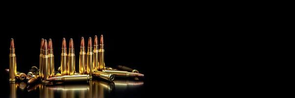 Bullet isolated on black background with reflexion. Rifle bullets close-up on black back. Cartridges for rifle and carbine on a black. photo