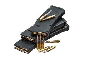Cartridges and clips for a rifle or carbine. Ammunition for weapons. Isolate on a white back. photo