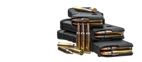 Cartridges and clips for a rifle or carbine. Ammunition for weapons. Isolate on a white back. photo