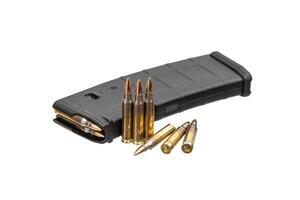 Cartridges and clips for a rifle or carbine. Ammunition for weapons. Isolate on a white back. photo