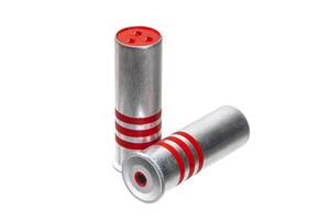 Ammunition for signal flares gun isolate on a white background. Silver ammo with red stripes. Red flares. photo