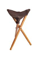 Folding wooden hunting stool tripod isolate on white background. Three-legged camping chair. photo
