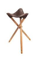 Folding wooden hunting stool tripod isolate on white background. Three-legged camping chair. photo