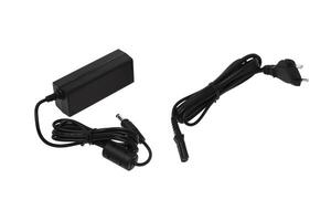 Power supply for various electronics. A device for converting AC 220 volts to DC. Isolate on a white back. photo