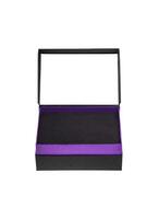 A small open black paper box with a purple stripe for a gift. Gift wrapping isolate on white background. photo