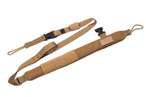 Nylon shoulder strap for a gun isolated on white back. Belt for comfortable carrying of weapons. photo