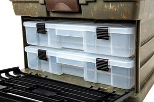 Portable plastic container with opening lid and additional sliding compartments. Fishing or hunting box. Isolate on a white back. photo
