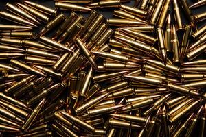 Background from cartridges for a carbine. Ammunition for modern weapons. photo