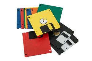 Multi-colored 3.5 floppy disks. Obsolete magnetic storage medium. Isolate on a white back. photo