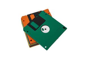 Multi-colored 3.5 floppy disks. Obsolete magnetic storage medium. Isolate on a white back. photo
