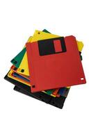 Multi-colored 3.5 floppy disks. Obsolete magnetic storage medium. Isolate on a white back. photo