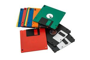 Multi-colored 3.5 floppy disks. Obsolete magnetic storage medium. Isolate on a white back. photo