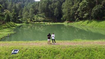 Drone aerial footage of a beautiful artificial lake surrounded by trees video