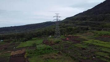 The drone's forward aerial motion captures the path of electricity in cloudy weather video