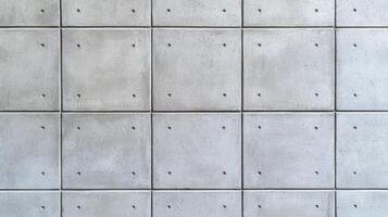 Closeup of a plain concrete wall background with smooth texture and subtle variations in light gray tones ideal for minimalist and modern designs photo