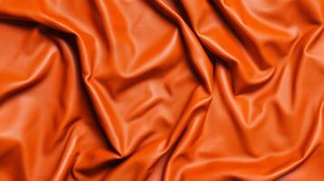 Deep orange wrinkled leather texture with hints of black spooky Halloween atmosphere evoking aged materials perfect for dark seasonal designs photo