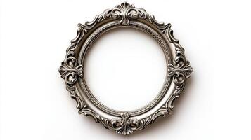 Top view of a vintage oval picture frame with a delicate lace like pattern and a slightly tarnished silver finish isolated on a white background with soft diffused shadows photo