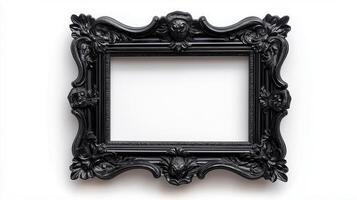 Overhead shot of a spooky ornate picture frame with detailed black carvings of owls spider webs and full moons isolated on a white background with subtle shadows photo