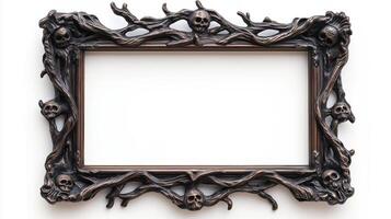 Overhead view of an ornate Halloween picture frame featuring creepy designs like ghost faces and twisted branches in a tarnished silver finish isolated on a white background photo