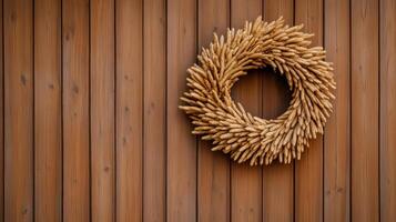 A barn door adorned with a wreath made of dried corncobs, symbolizing the rustic charm of harvest season photo