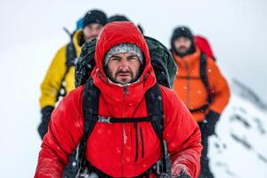 Alpine climbers brace against blizzards on an icy mountain summit photo