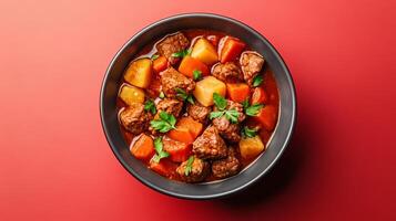 Bowl of hearty beef stew with tender chunks of meat, root vegetables, and rich gravy, rustic vibes set against a gradient background from deep red to earthy brown photo