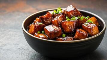 Chinese braised pork belly with chestnuts in a rich soy based sauce, hearty and glossy, served against a gradient background from dark brown to warm amber photo