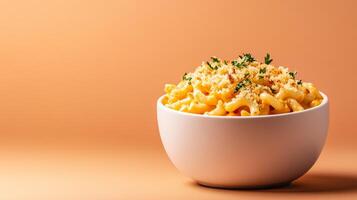 Comforting bowl of butternut squash mac and cheese, creamy and golden, with crispy breadcrumbs, against a gradient background transitioning from rich amber to burnt orange photo