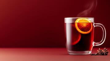 Cozy mulled wine with red wine, cloves, and orange slices, steam rising from the glass mug, warm autumn hues on a gradient background transitioning from deep burgundy to golden amber photo