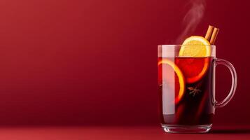 Cozy mulled wine with red wine, cloves, and orange slices, steam rising from the glass mug, warm autumn hues on a gradient background transitioning from deep burgundy to golden amber photo