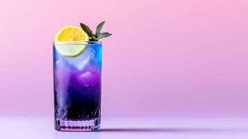 Exotic cocktail with butterfly pea flower tea, gin, and lemon, shifting from deep blue to vibrant purple in a glass, served against a gradient background fading from indigo to soft lavender photo