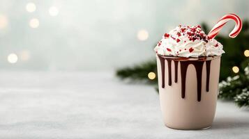 Frosty peppermint mocha with candy cane garnish, whipped cream, and chocolate drizzle, placed on a snowy table with frosted evergreen branches and soft winter bokeh in the background photo