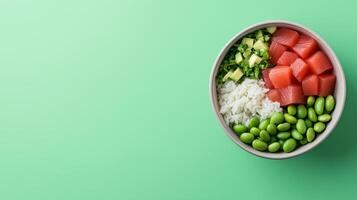 Light and colorful poke bowl with tuna, avocado, edamame, and rice, positioned in the lower half with empty space above for text, soft pastel gradient background photo