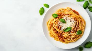 Rustic plate of spaghetti Bolognese with rich tomato sauce and grated Parmesan, styled in a minimalist way with ample white space around the dish for text photo