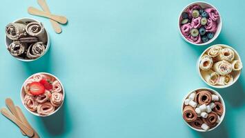 rolled ice creams in cone cups on blue background photo