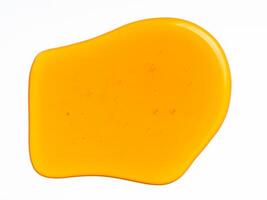 Honey drop abstract pattern or background, isolated on white photo