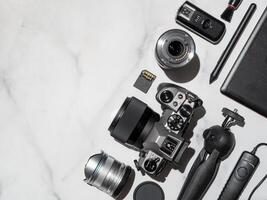 Camera and accessories on table, copy space photo