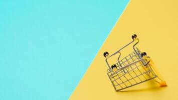 Empty inverted shopping cart, copy space photo