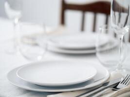 Beautiful table setting in white colors photo