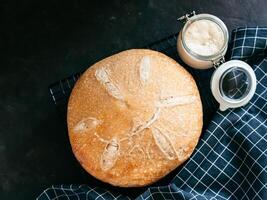 Wheat round sourdough bread, copy space, top view photo